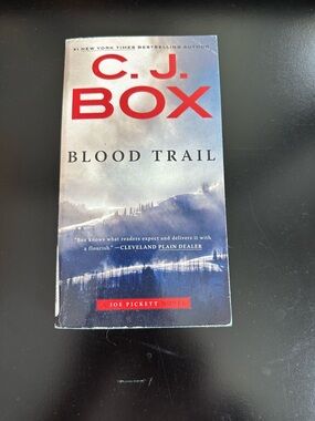C.J. Box "Blood Trail" Paperback Thriller in Blue and Red